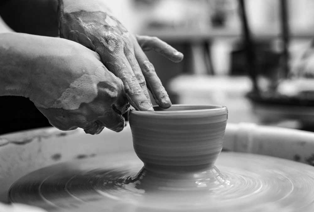 Throwing clay pottery
